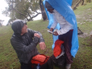 Simien Mountain tour guide Melese Beza of Outstanding Simien Mountains Tours and Tim Landers, RN, PhD do a show and tell of their first aid kits during a rain break while trekking through the Simien Mountains north of Gondar, Ethiopia.